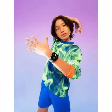 Green accents on shirt and watch create a fresh, fun look for young adventurers.