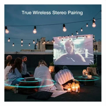 Group of friends watches a movie on a rooftop projector screen under string lights with true wireless stereo pairing speaker glowing blue.